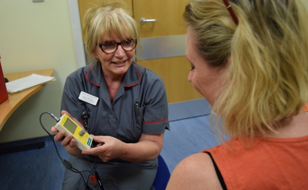 Nurse shows TENS machine